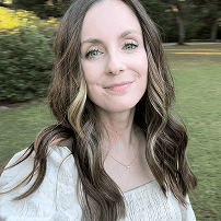 headshot of Taylor, outside of house